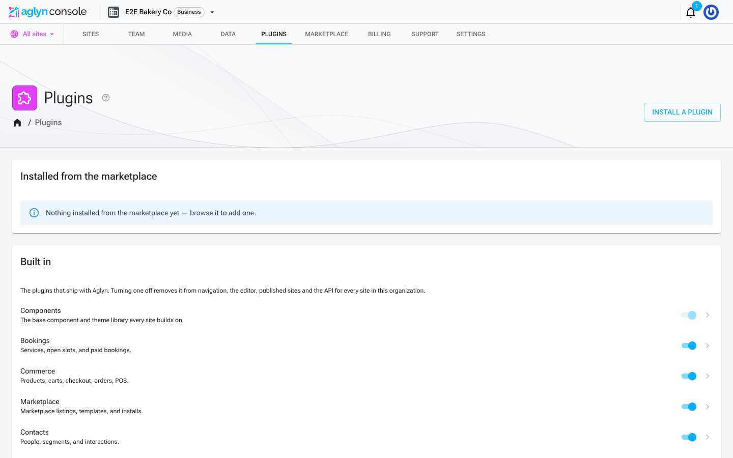 The org Plugins section: an "Installed from the marketplace" card above "Built in", each first-party plugin with an on/off switch