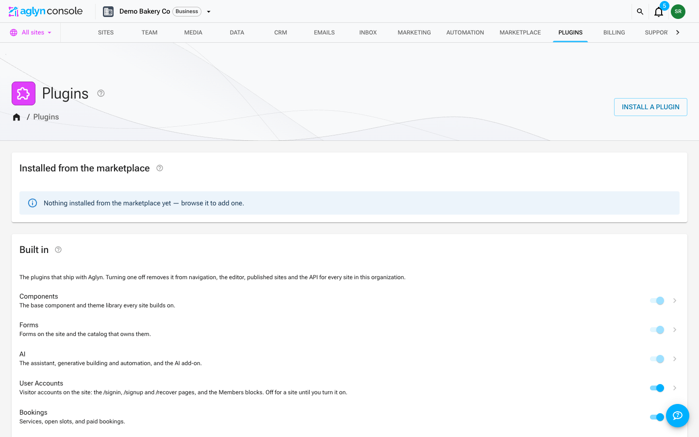 The org Plugins section: an "Installed from the marketplace" card above "Built in", each first-party plugin with an on/off switch